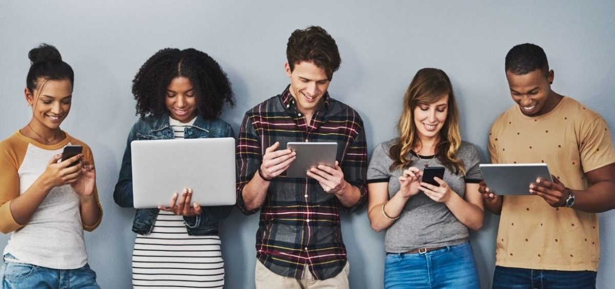 Group of older youth on laptops/smart phones