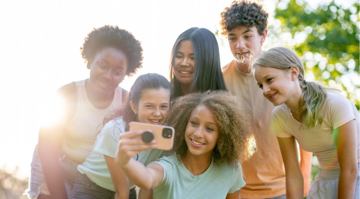 Teens Taking Selfie In Sunshine_Cover Image